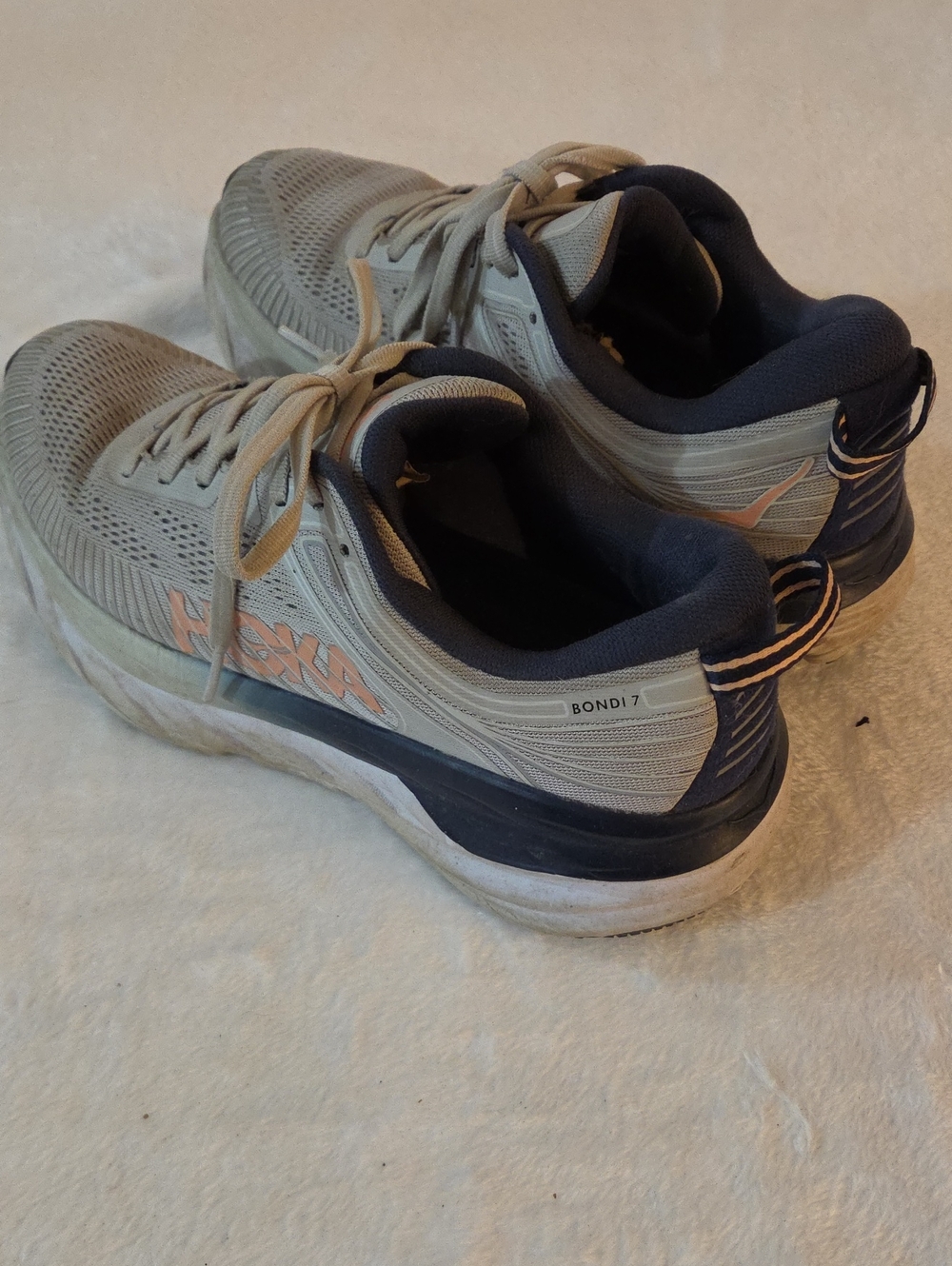 Hoka Bondi 7 Running Shoes in Light Gray and Navy with Peach Logo